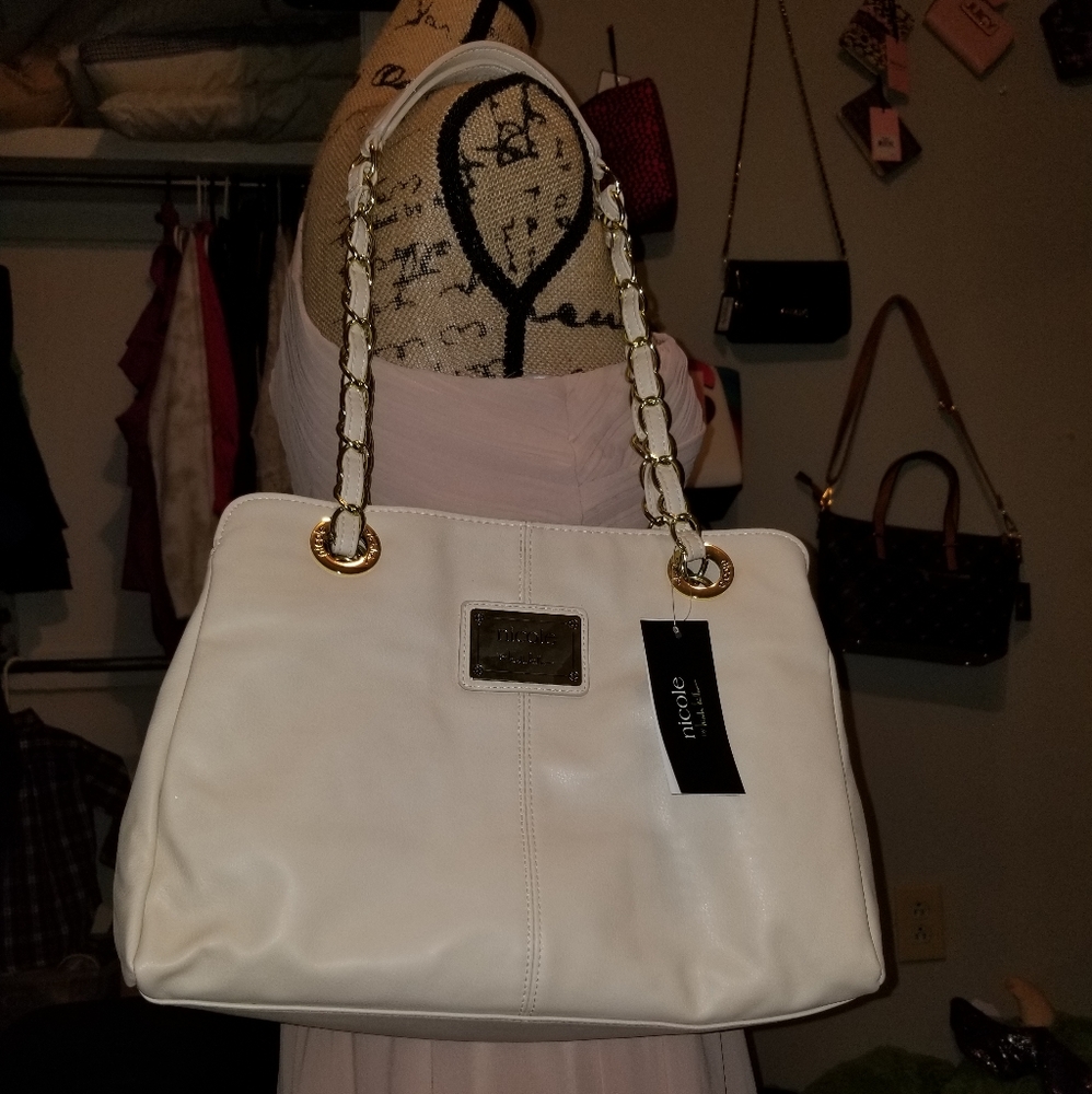 Nicole Miller cream colored purse